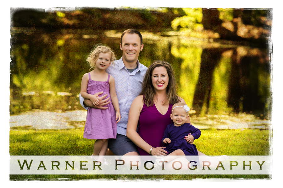 The Konkus Family portrait at Dow Gardens in front of the water in Midland Michigan