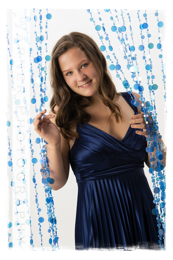A senior portrait at the Warner Photography Studio of Midland High School Senior Taryn with blue beads