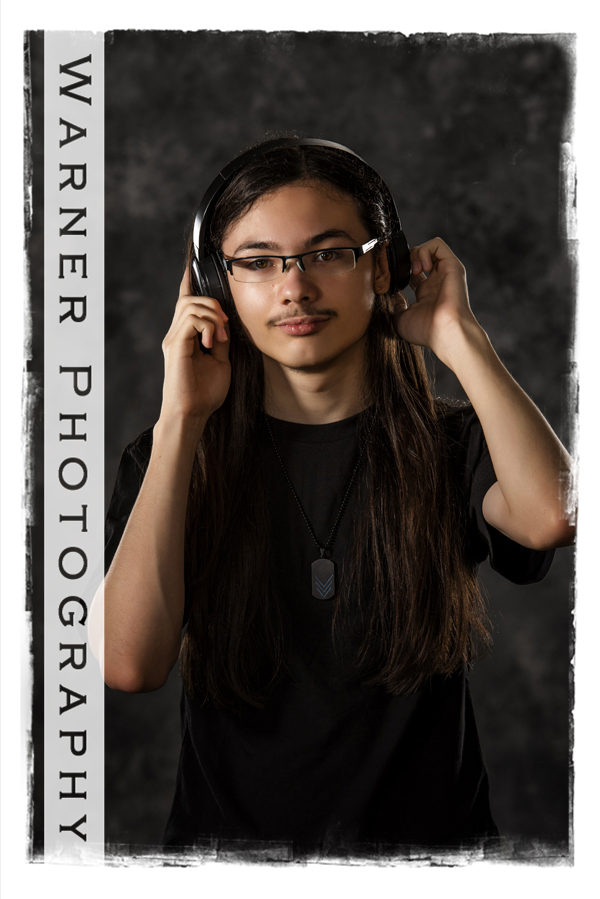 Senior portrait Dow High School senior Drew at the Warner Photography Studio with headphones
