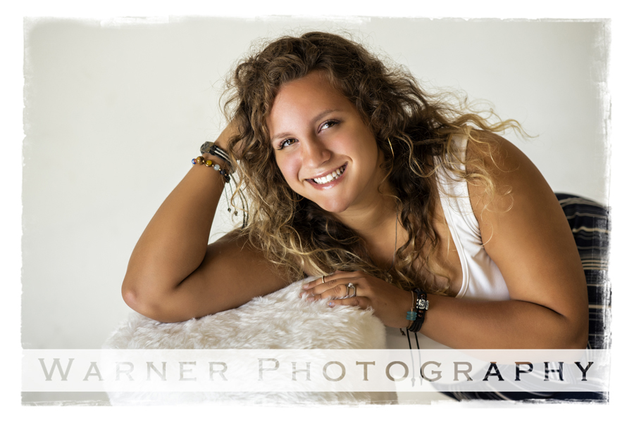Studio portrait of Harrison High School senior Rose with a white stool