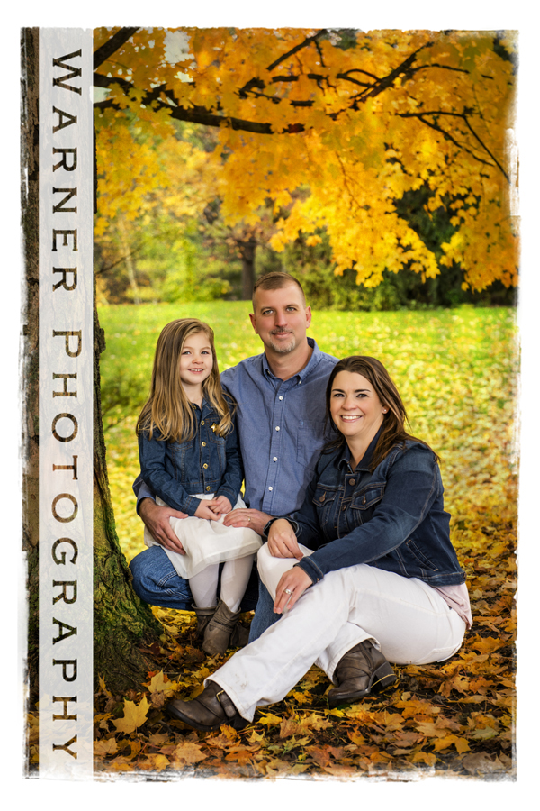 outdoor family portrait of the Letzkus family at Dow Gardens with yellow fall leaves