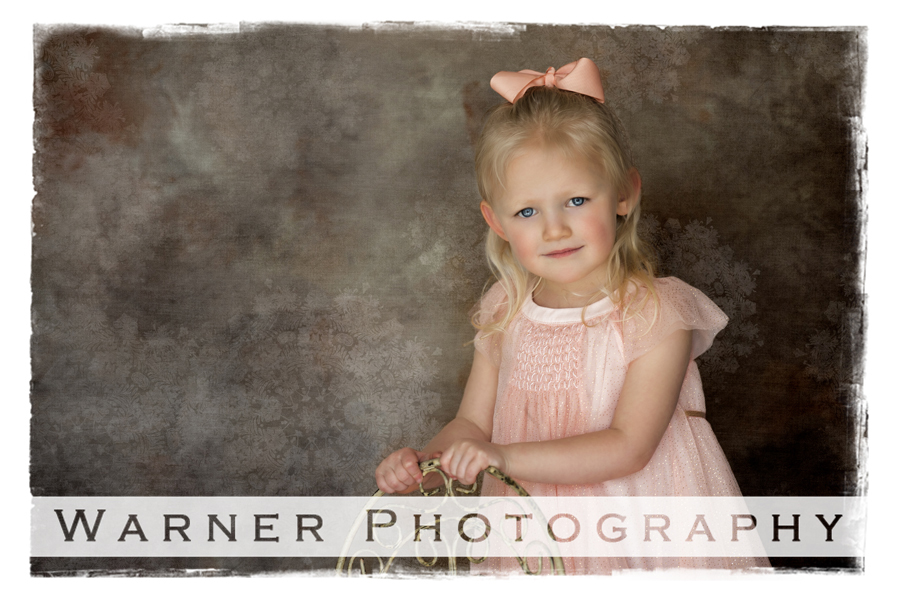 studio portrait of Charlie with a small chair