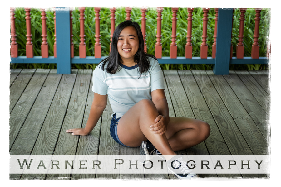 Outdoor portrait of Dow High School senior Emily on a wooden porch