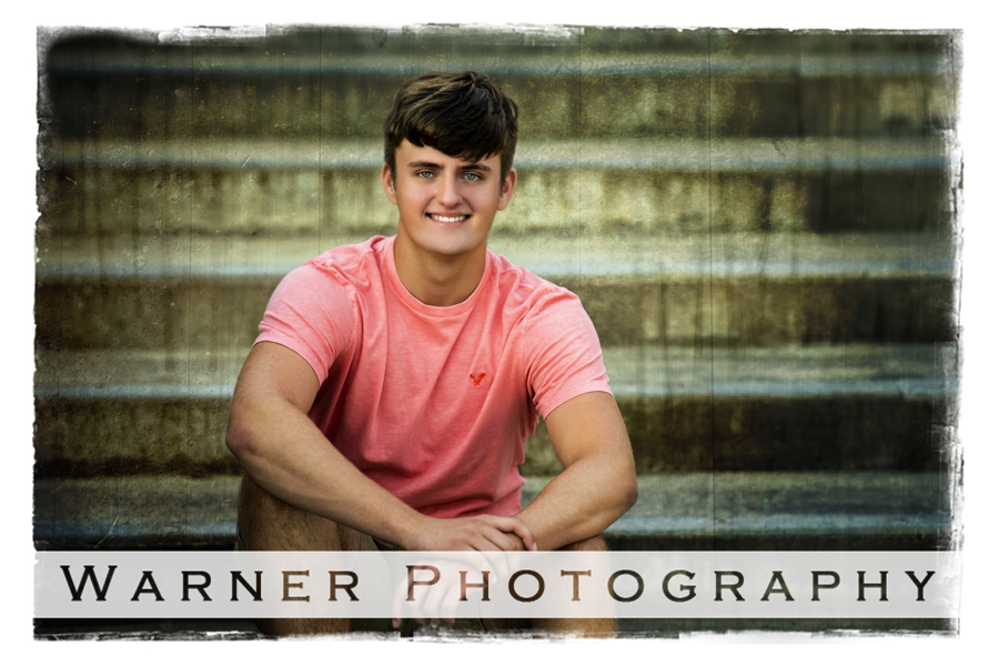 Outdoor portrait of Hemlock High School senior Carter on steps in Downtown Midland