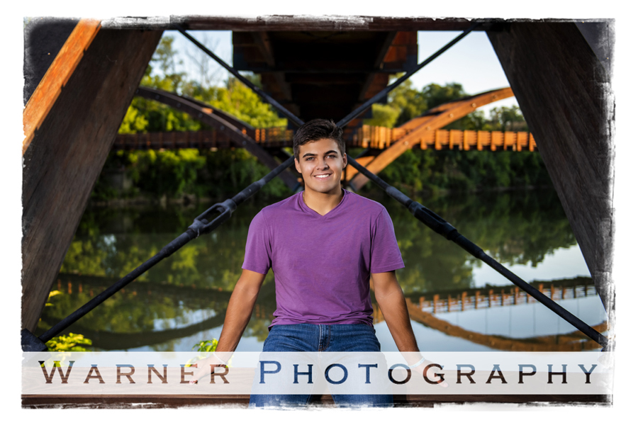 Outdoor senior portrait of Midland High School senior Drew by the tridge in Downtown Midland