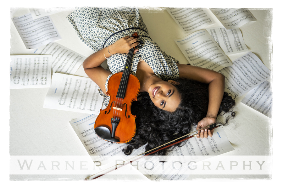 studio portrait of Midland High School senior Meghana with her violin and music sheets