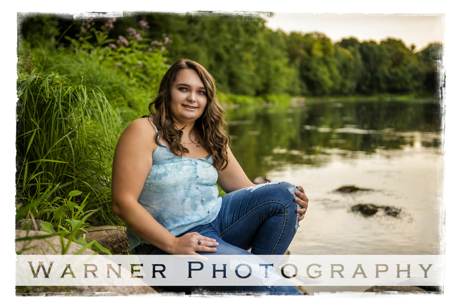 Outdoor senior portrait of Fike High School senior Miranda by the river at Chippewa Nature Center
