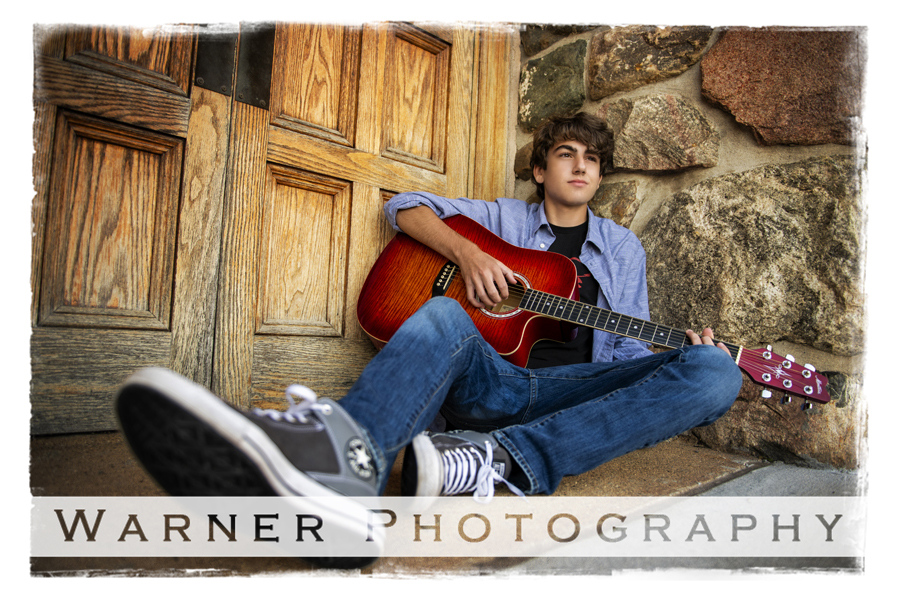 A outdoor portrait of Dow High School senior Tristin on the steps of a building in Downtown Midland