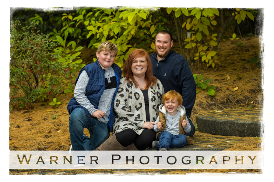 an outdoor family portrait of the Demski family at Dow Gardens