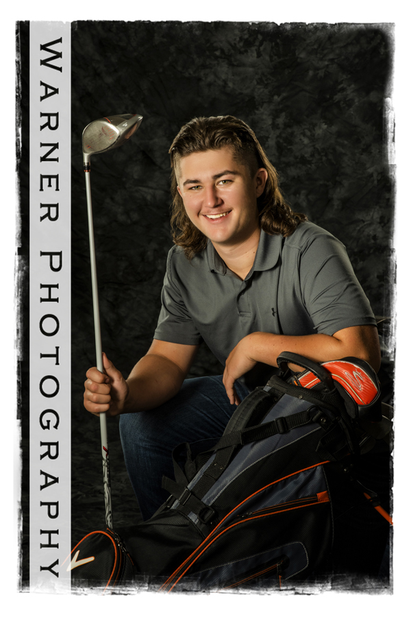 a studio portrait of Merrill High School senior Evan with his golf clubs