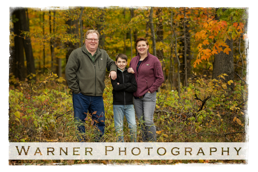 an outdoor portrait of the Randall family at Chippewa Nature Center with the fall trees