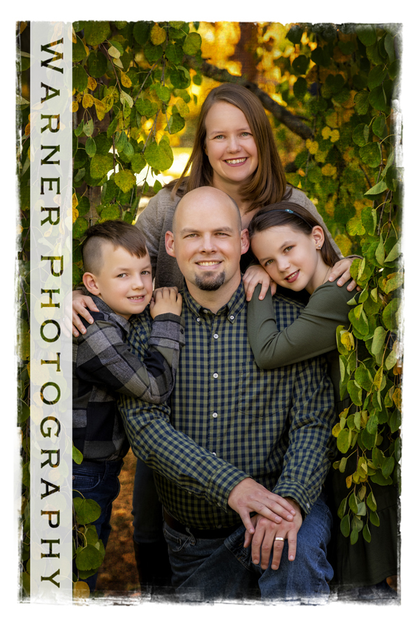 an outdoor portrait of the Wolters family at Dow Gardens