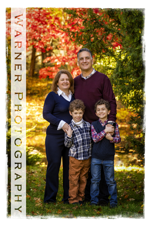 An outdoor portrait of the Rapanos family at Dow Gardens with the fall leaves