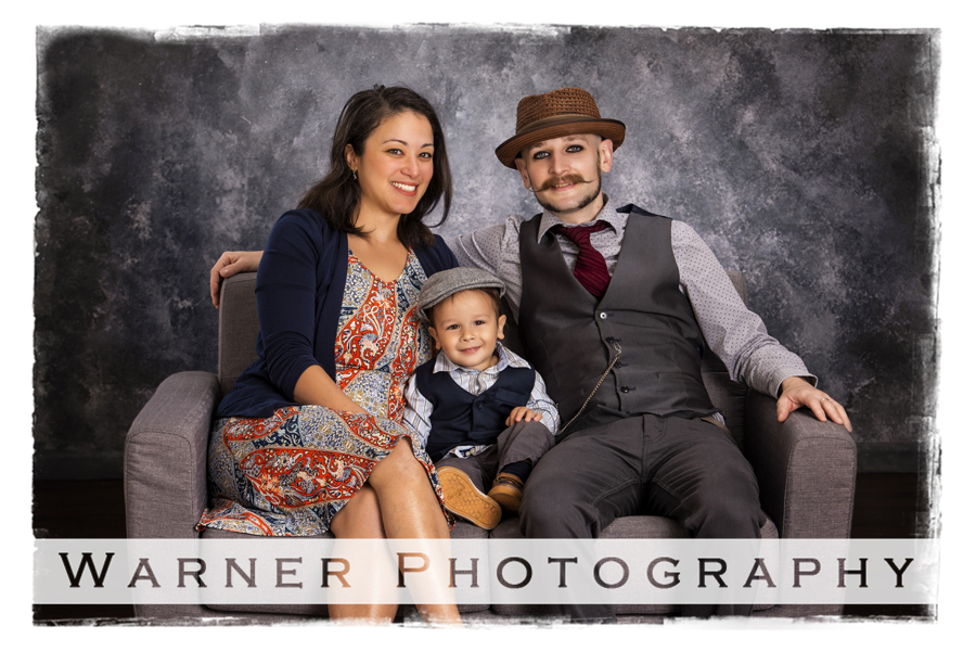 a studio portrait of the Mahabir family