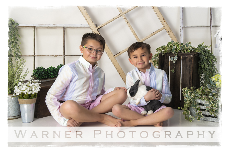 A studio portrait of Ian and Anson for their Easter session with the bunnies