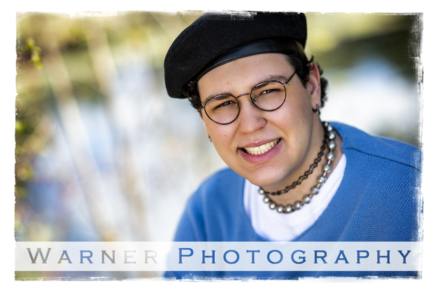 a outdoor portrait of Midland High School senior James at Dow Gardens