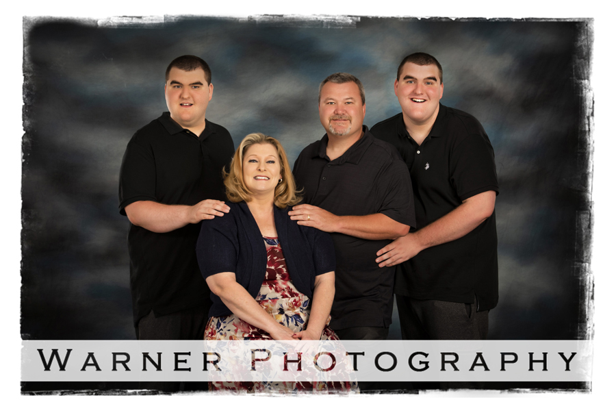 A studio portrait of the Vandenburg family at the Warner Photography Studio