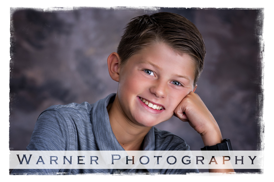 A studio portrait of Ben for his Back to School session at the Warner Photography Studio