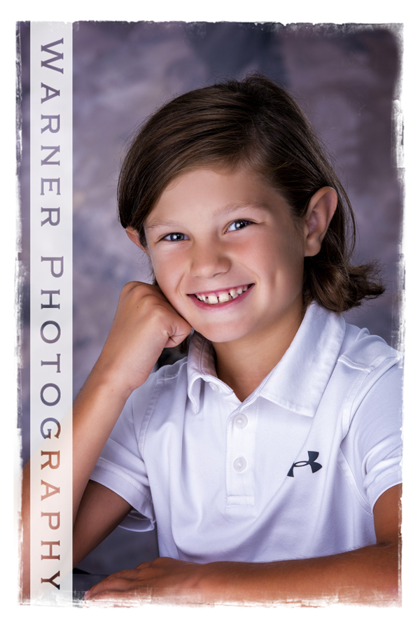 A studio portrait of Drew for his Back to School session at the Warner Photography Studio
