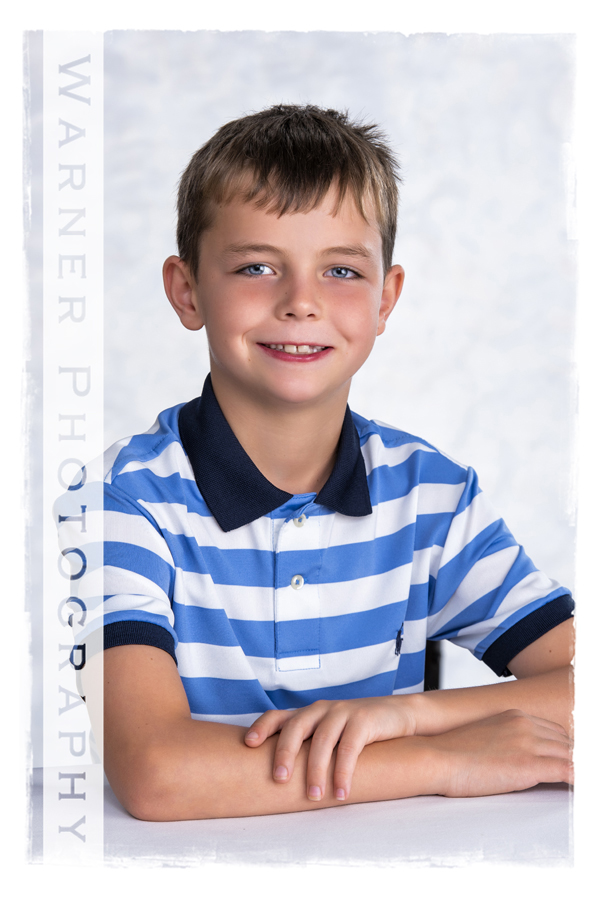 A studio portrait of Dylan for his Back to School session at the Warner Photography Studio