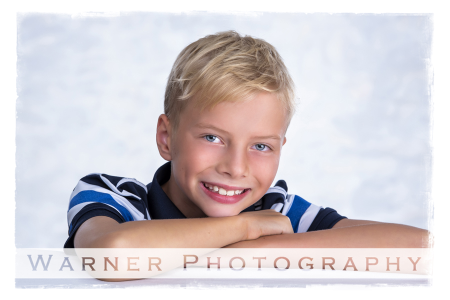 A studio portrait of Quinten for his Back to School session at the Warner Photography Studio