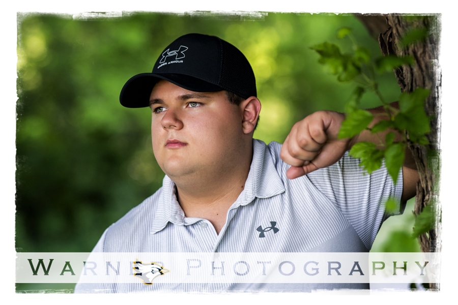 An on location portrait of Shepherd High School senior Will at a golf course by Warner Photography