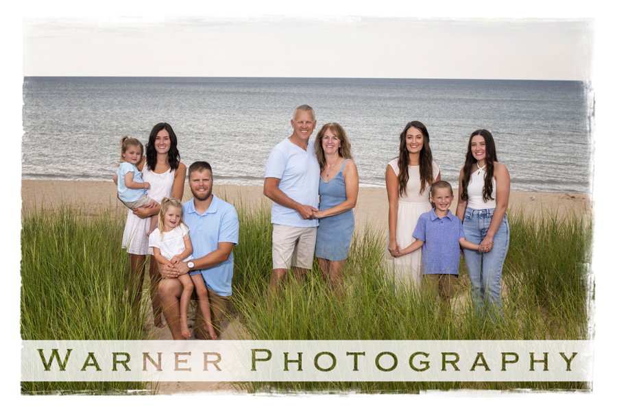 An on location portrait of the Daniels family in Pentwater at the beach by Warner Photography