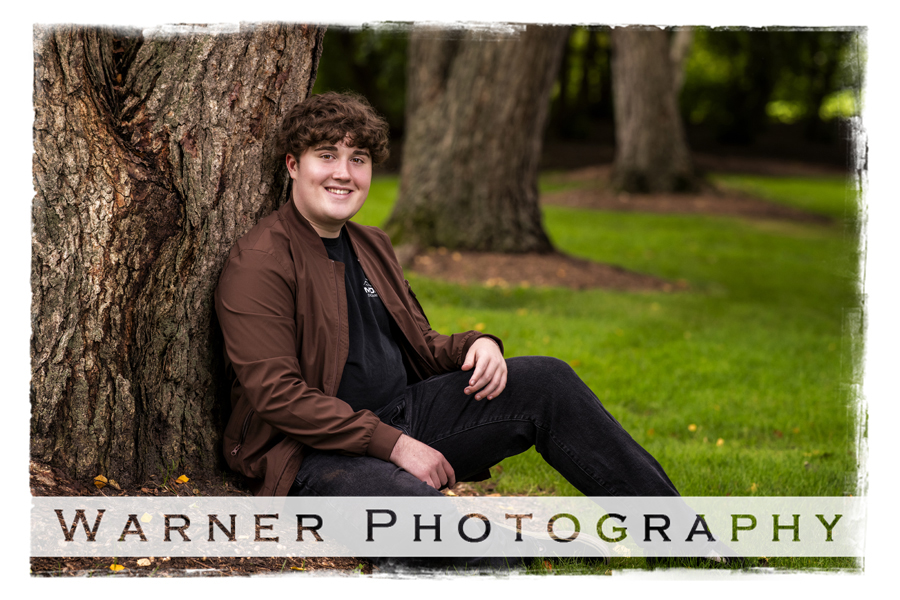 An on location portrait of Midland High School senior Ethan at Dow Gardens by Warner Photography