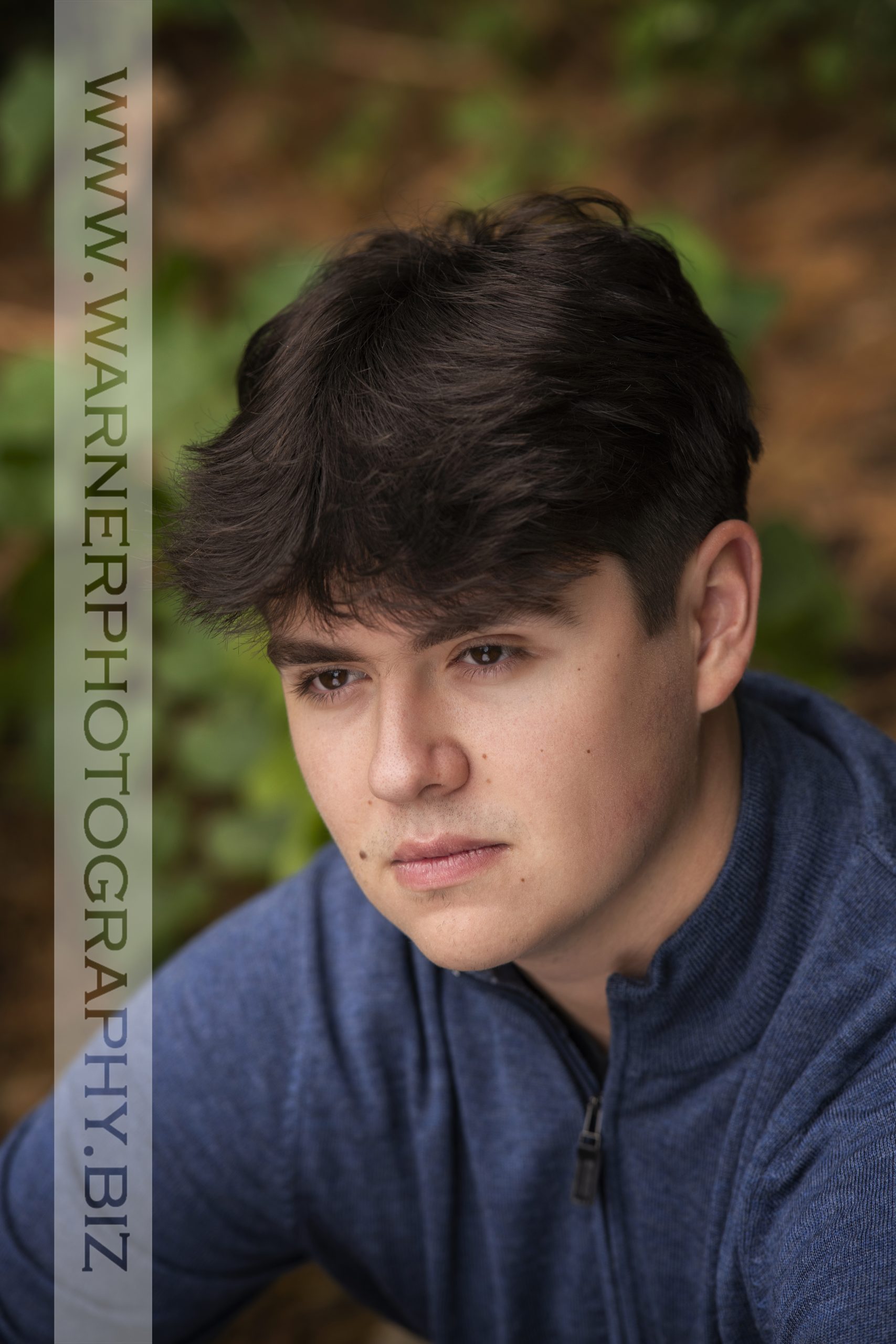 An on location portrait of Dow High School senior Dylan at Dow Gardens by Warner Photography