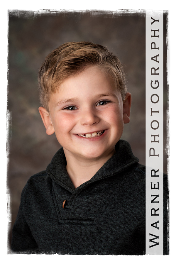 A studio portrait of Henry for his Back to School session at the Warner Photography Studio in Midland Michigan
