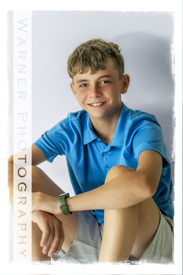 A studio portrait of Dylan for his Back to School session at the Warner Photography Studio