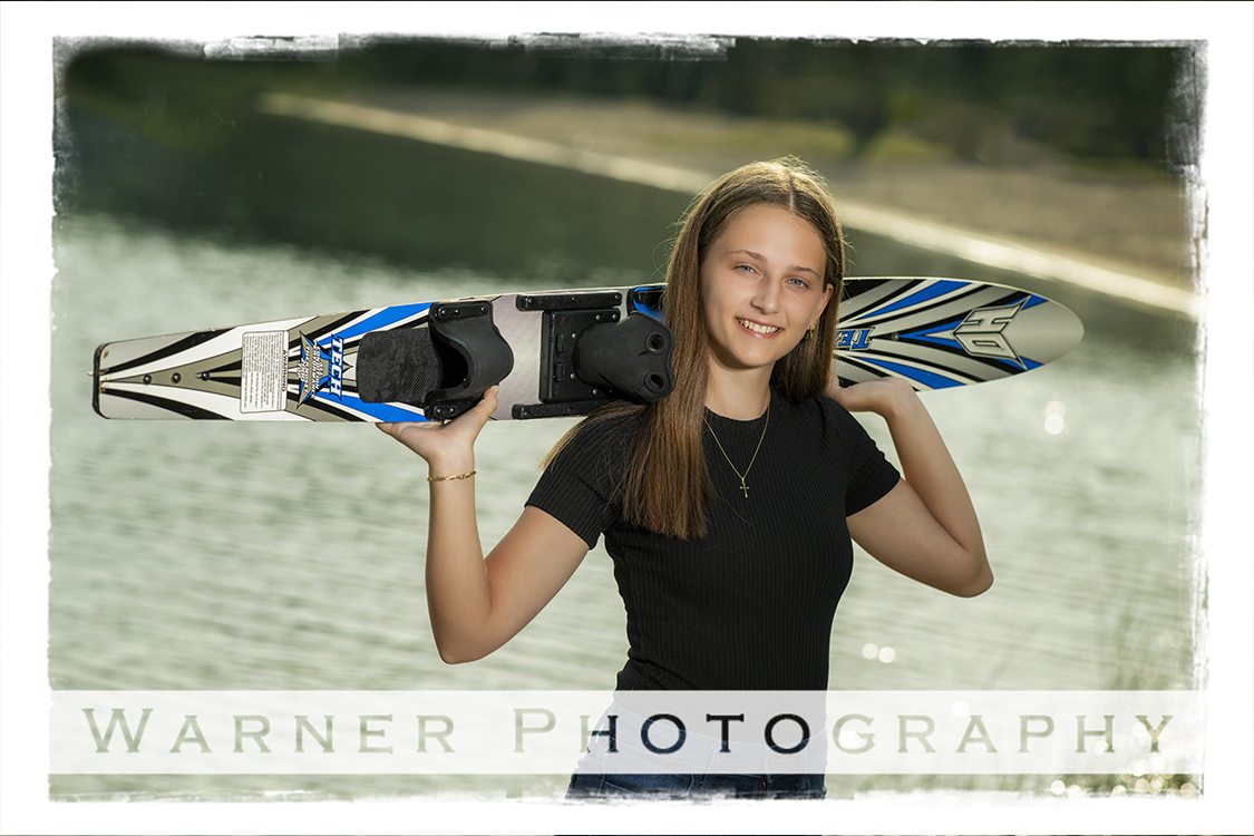 An on location portrait of Dow High School senior Amaya at Clear Lake in Atlanta Michigan by Warner Photography