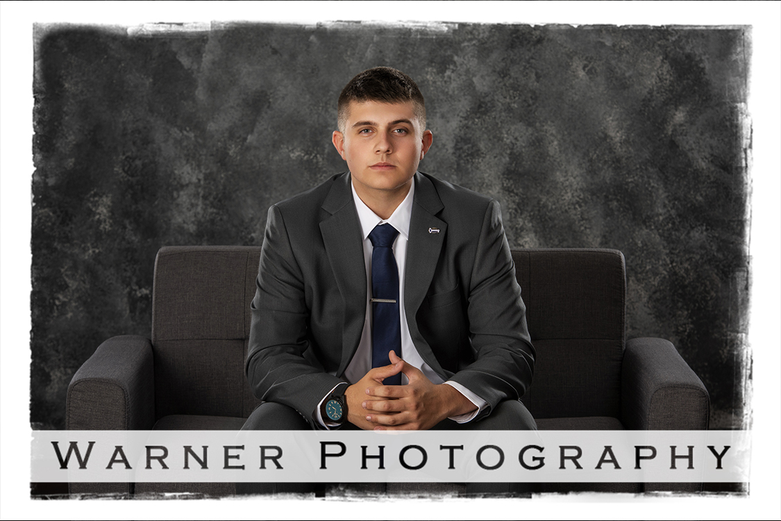 A studio portrait of Calvary Baptist Academy senior Noah at the Warner Photography Studio in Midland Michigan